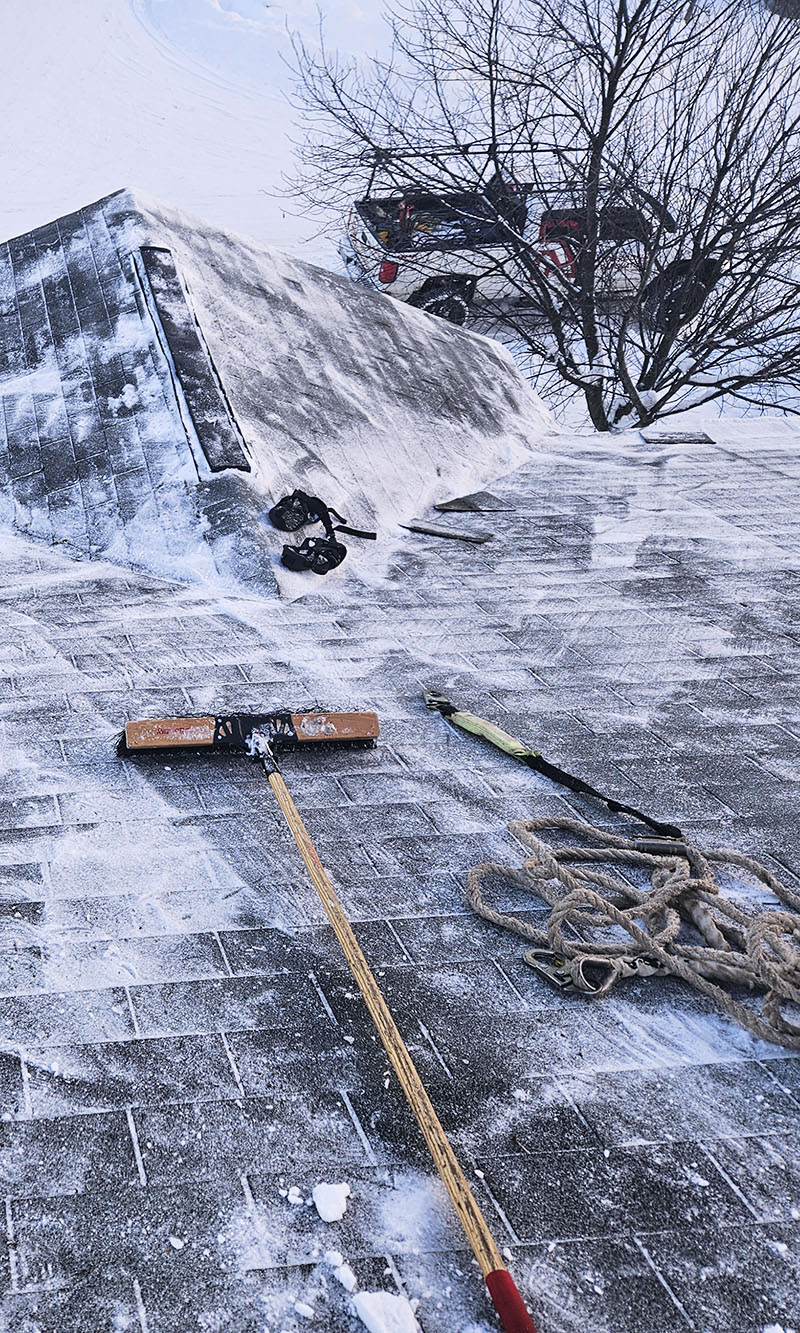 Rooftop Snow Removal in Anchorage, AK with Reds Roofing Company